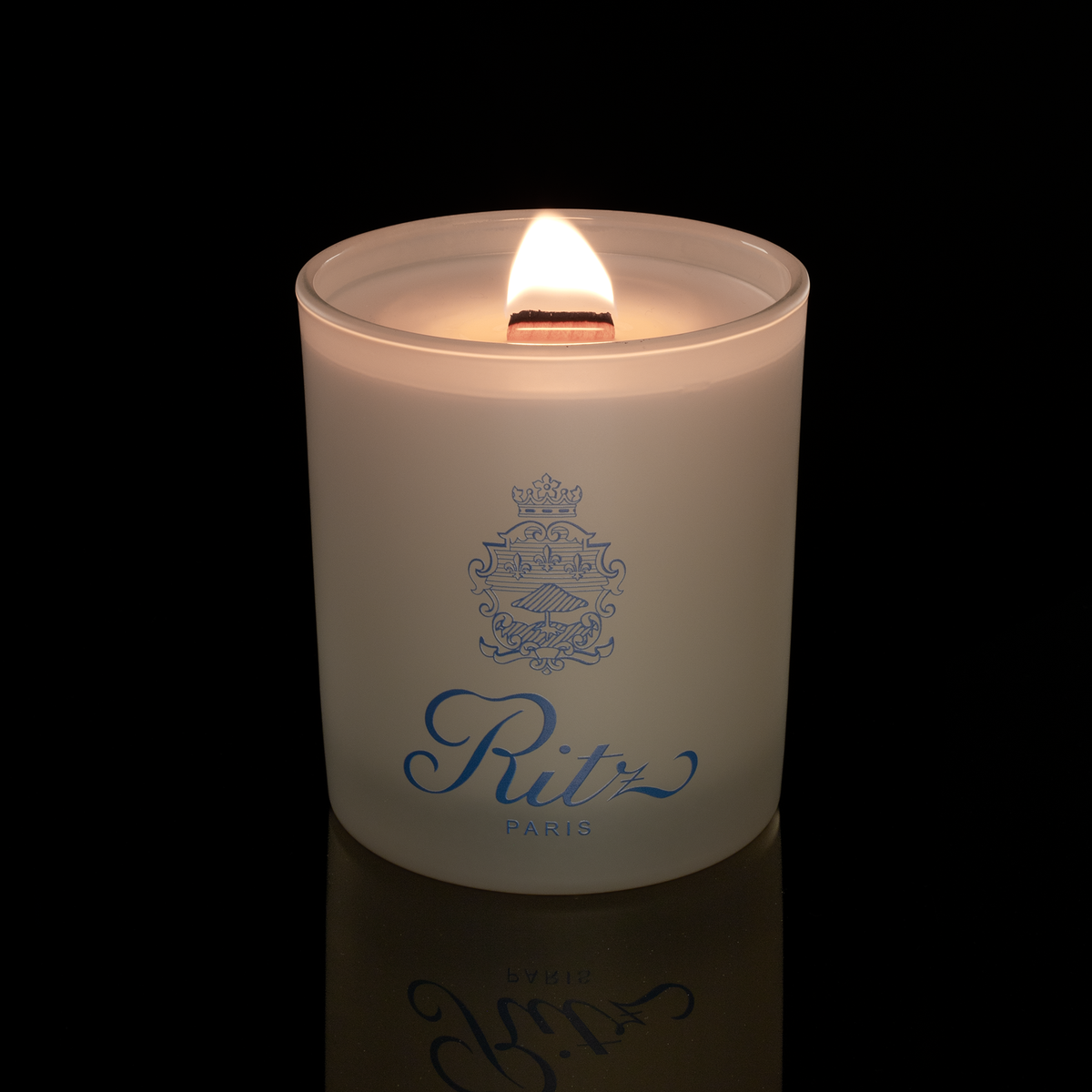 14 oz. Ivory glass candle with custom printed logo from Bath Promotions, shown lit — Lit version