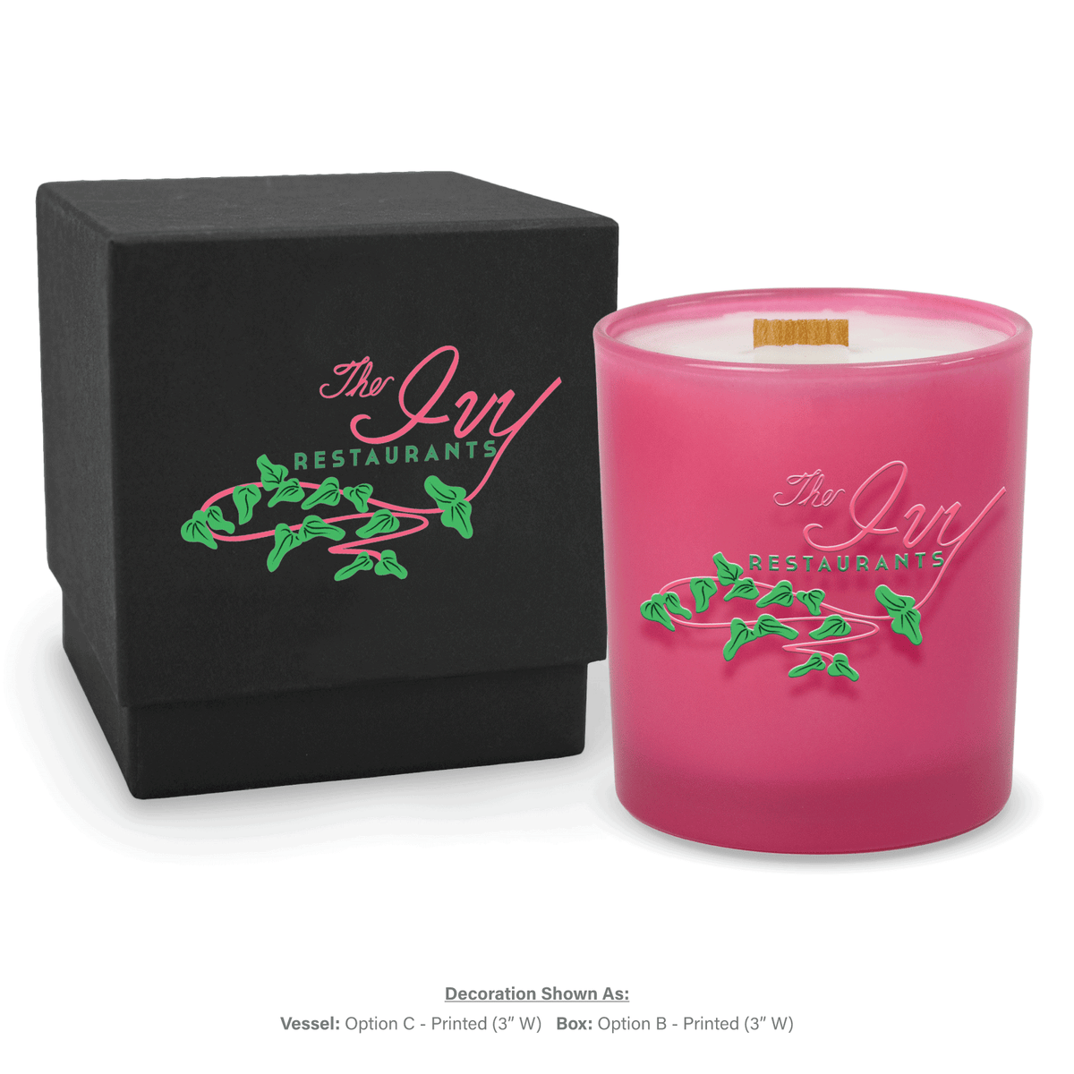 14 oz. Pink glass candle with custom printed logo next to its matching Black gift box