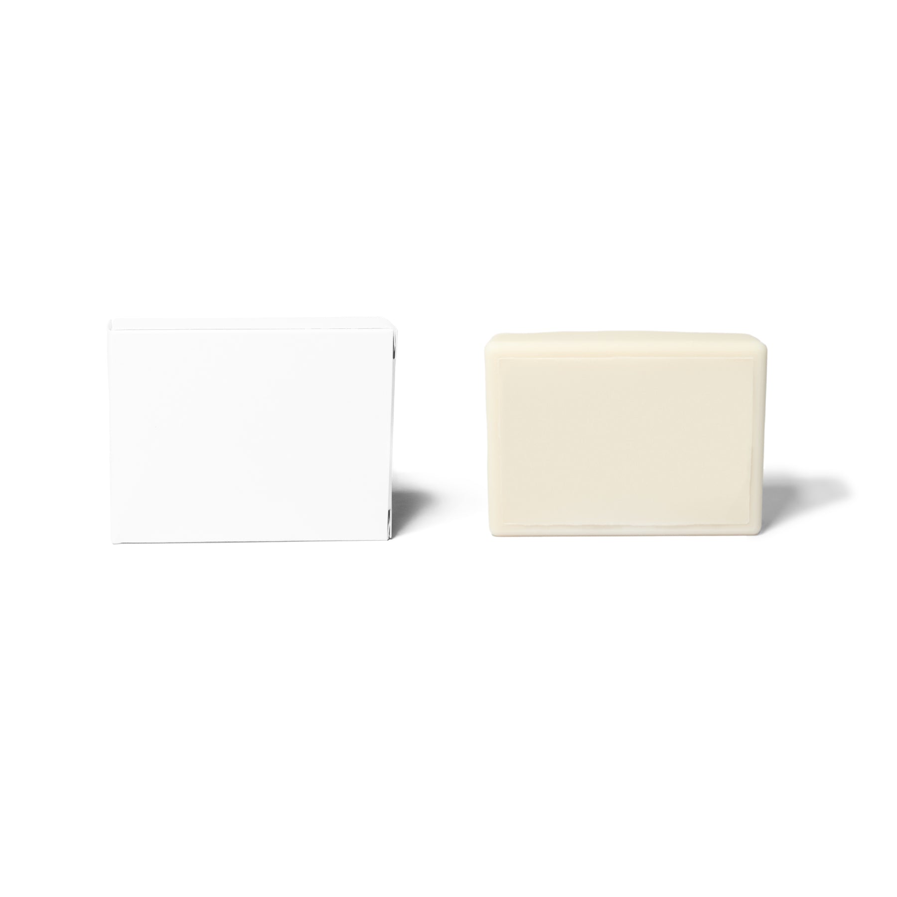 Blank rectangular bar soap, next to white box.