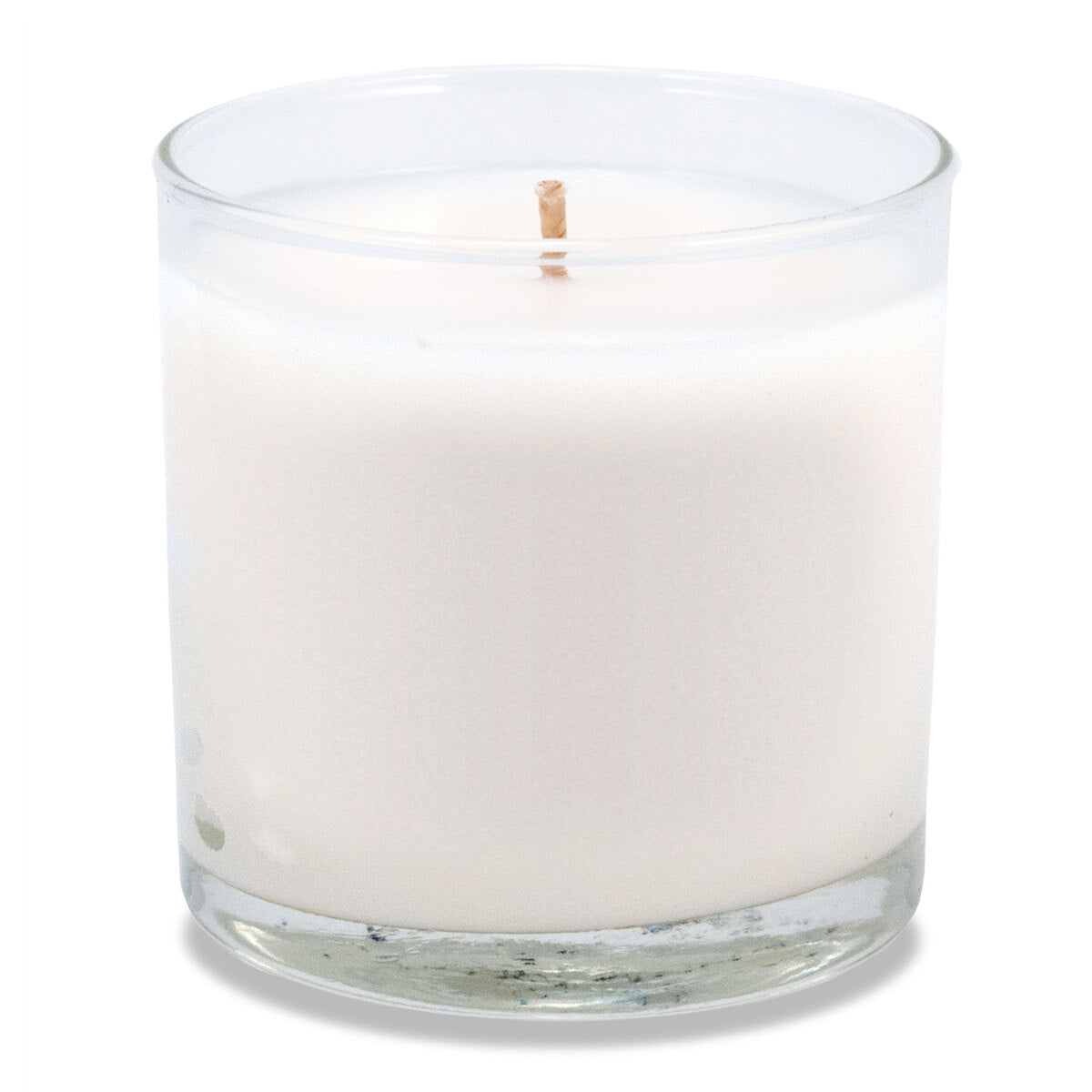 6 oz clear glass candle with white wax and cotton wick in cylindrical vessel.
