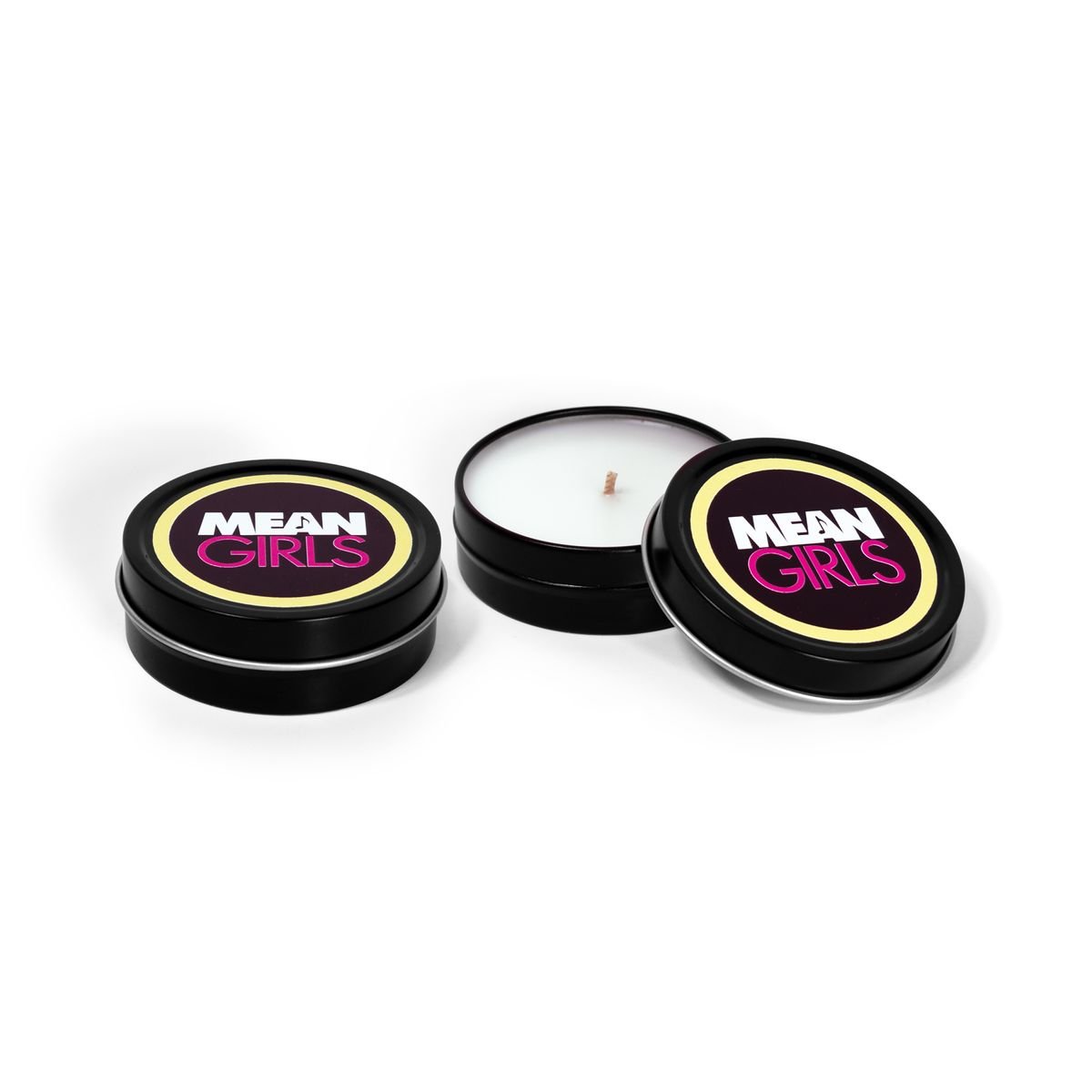 Two 2 oz black tin travel candles with white wax and cotton wicks, featuring multicolor design on lids - one closed and one open.