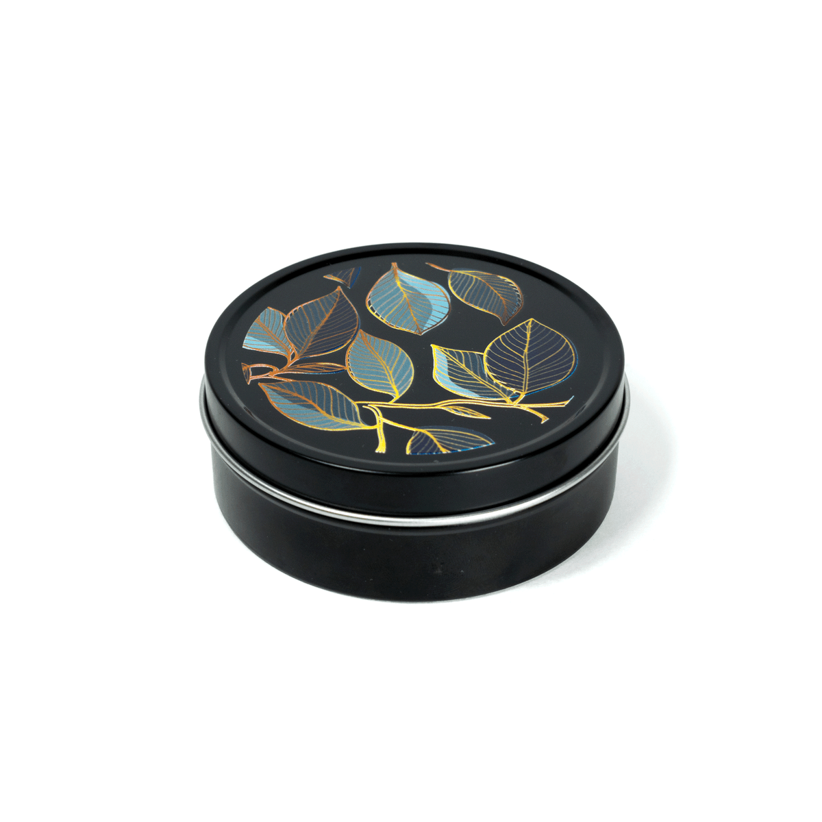 4 oz black tin travel candle shown with removable black lid featuring multicolor imagery.