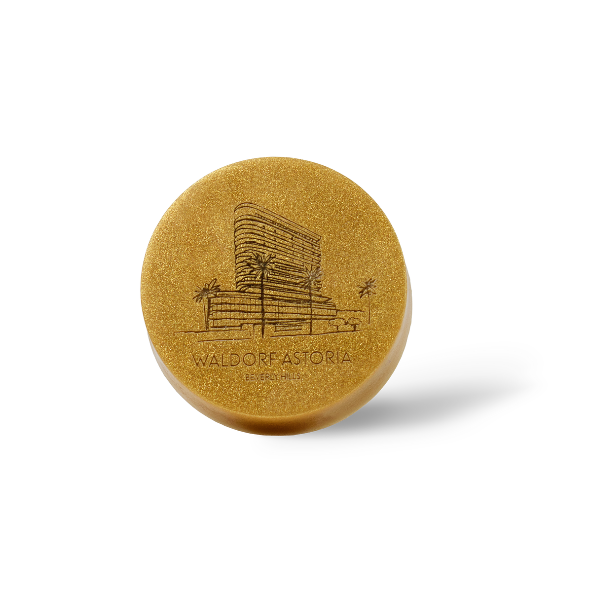 Private label gold round bar soap with engraved logo, manufactured by Bath Promotions