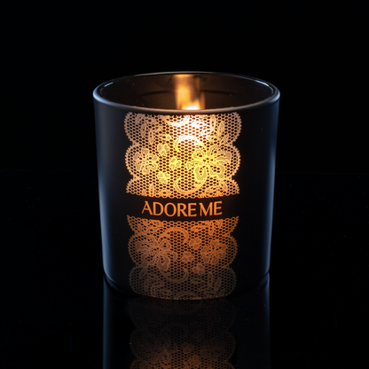 14 oz. Black glass candle with custom engraved logo from Bath Promotions, shown lit — Lit version