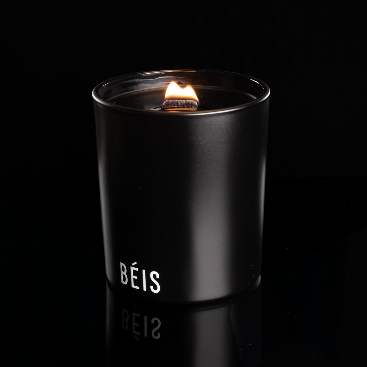 14 oz. Black glass candle with custom printed logo from Bath Promotions, shown lit — Lit version