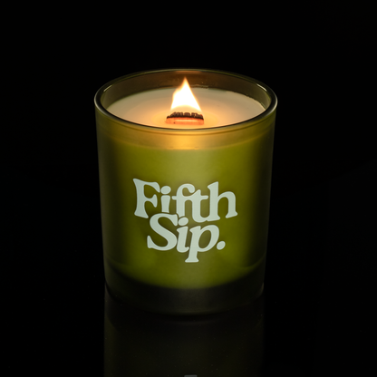 14 oz. Green glass candle with custom printed logo from Bath Promotions, shown lit — Lit version