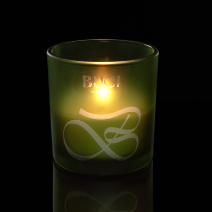 9 oz. Green glass candle with custom engraved logo from Bath Promotions, shown lit — Lit version