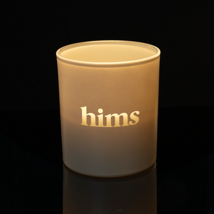 14 oz. Nude glass candle with custom engraved logo from Bath Promotions, shown lit — Lit version