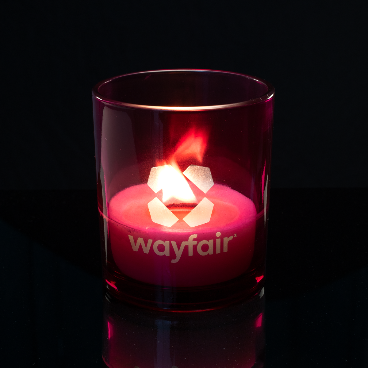 14 oz. Purple glass candle with custom engraved logo from Bath Promotions, shown lit — Lit version