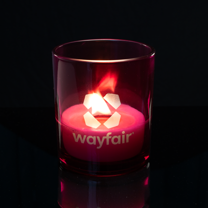 14 oz. Purple glass candle with custom engraved logo from Bath Promotions, shown lit — Lit version