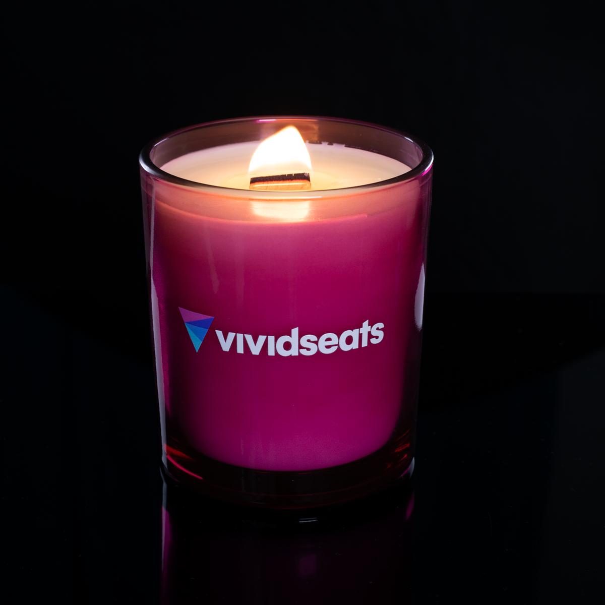 14 oz. Purple glass candle with custom printed logo from Bath Promotions, shown lit — Lit version