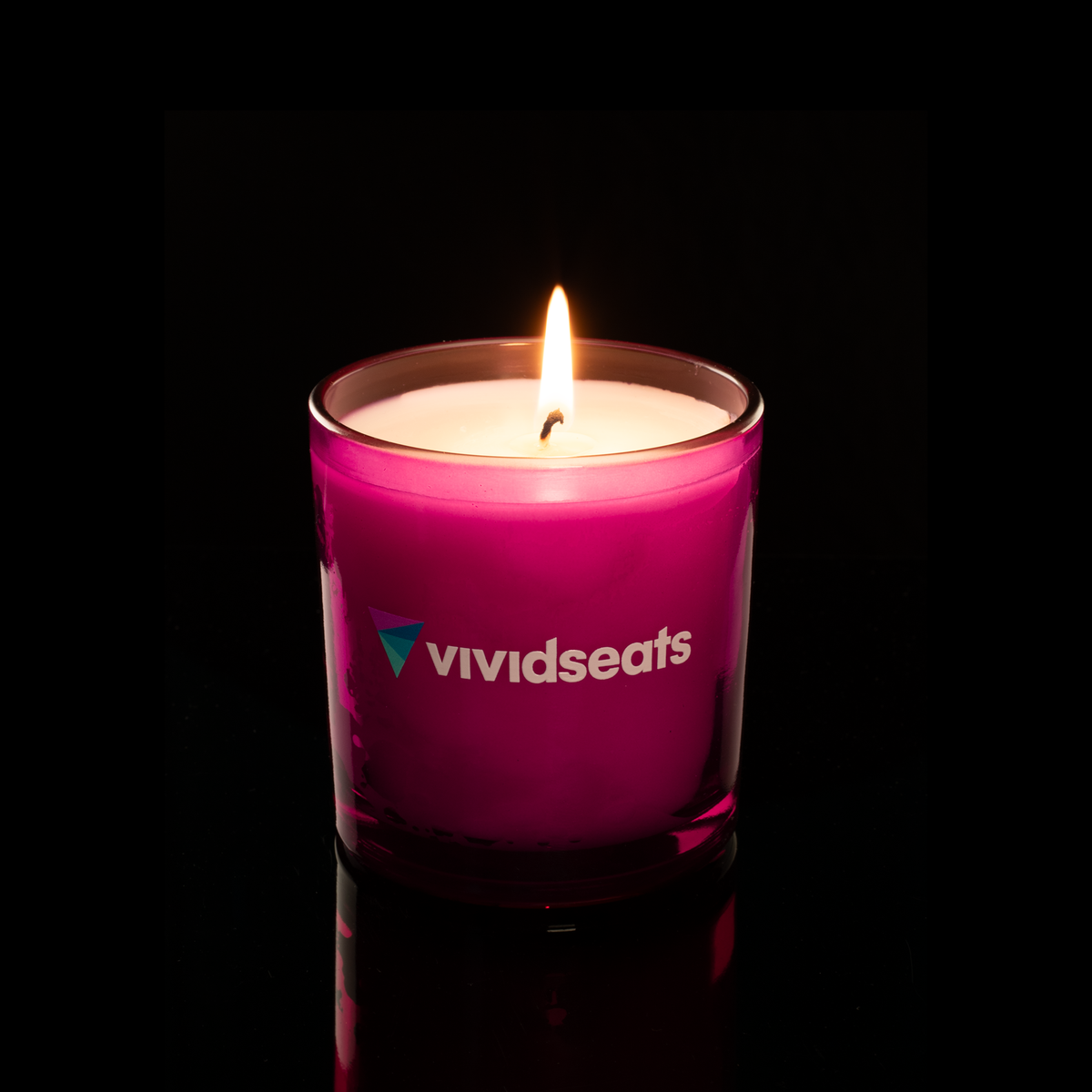 9 oz. Purple glass candle with custom printed logo from Bath Promotions, shown lit — Lit version