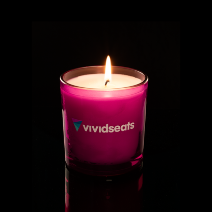 9 oz. Purple glass candle with custom printed logo from Bath Promotions, shown lit — Lit version