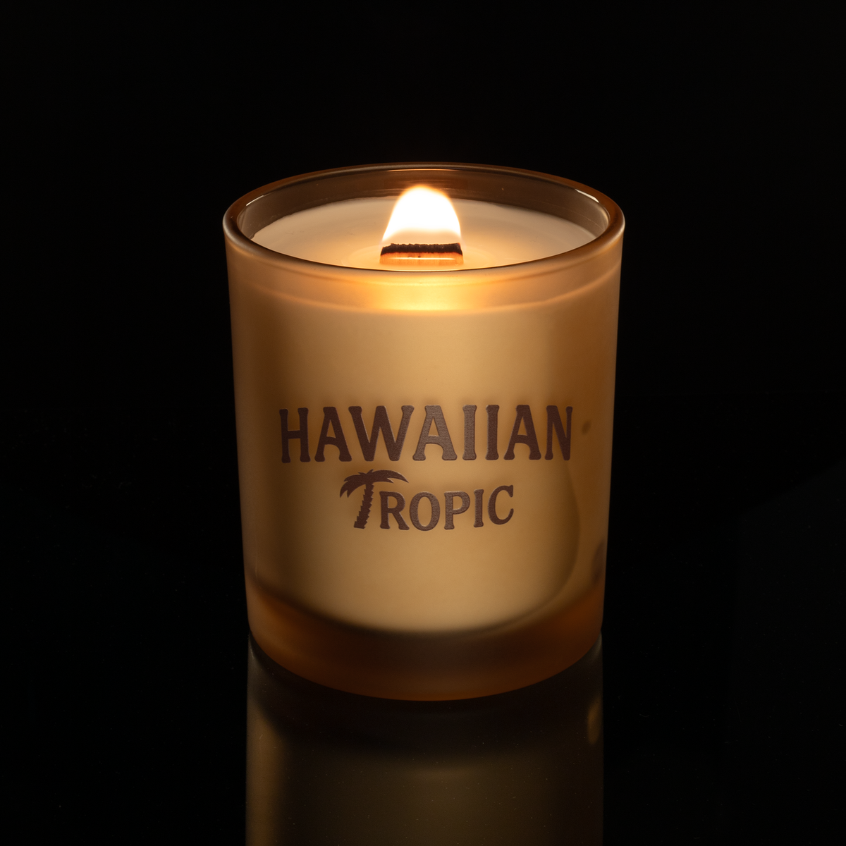 14 oz. Sand glass candle with custom printed logo from Bath Promotions, shown lit — Lit version