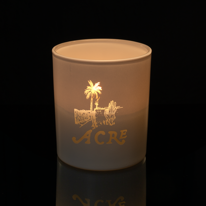 14 oz. White glass candle with custom engraved logo from Bath Promotions, shown lit — Lit version