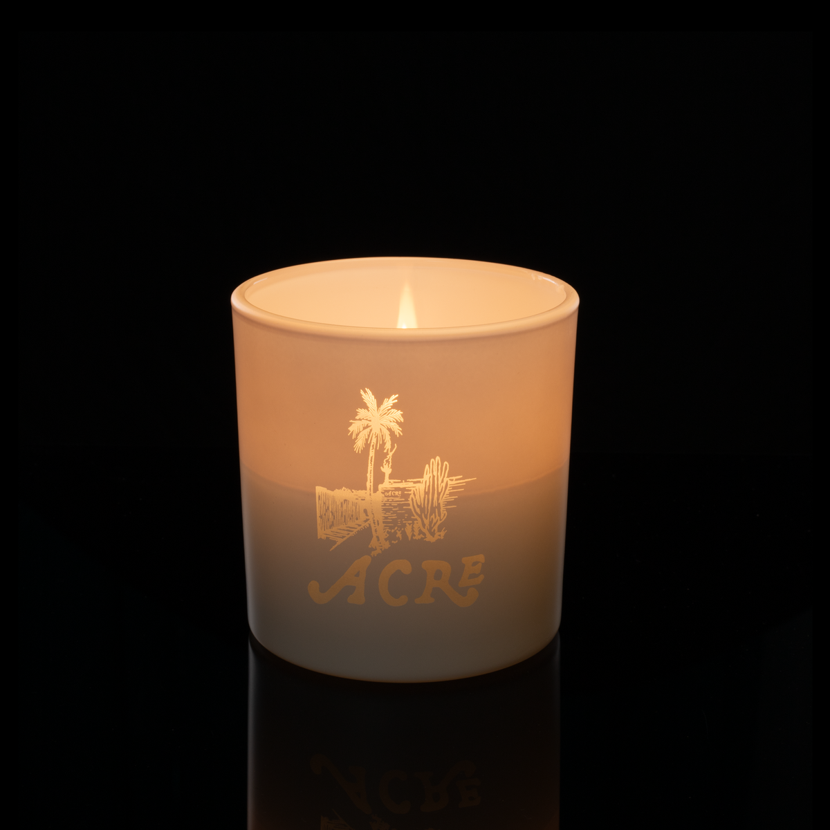 9 oz. White glass candle with custom engraved logo from Bath Promotions, shown lit — Lit version