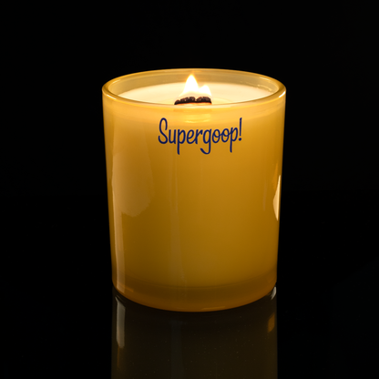 14 oz. Yellow glass candle with custom printed logo from Bath Promotions, shown lit — Lit version