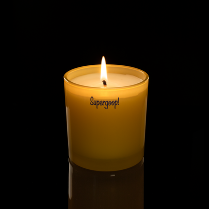 9 oz. Yellow glass candle with custom printed logo from Bath Promotions, shown lit — Lit version