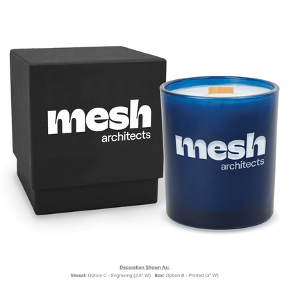 14 oz. Blue glass candle with custom engraved logo next to its matching Black gift box
