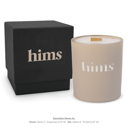 14 oz. Nude glass candle with custom engraved logo next to its matching Black gift box
