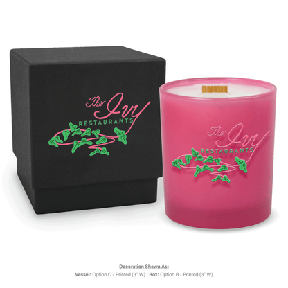 14 oz. Pink glass candle with custom printed logo next to its matching Black gift box