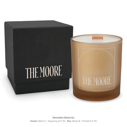 14 oz. Sand glass candle with custom engraved logo next to its matching Black gift box
