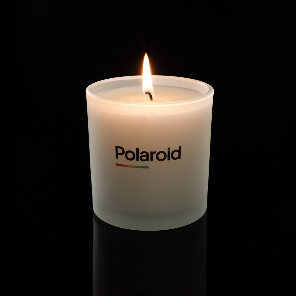 9 oz. Frosted glass candle with custom printed logo from Bath Promotions, shown lit — Lit version