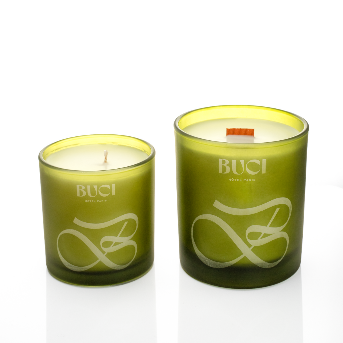 Green glass candles, 9 oz. beside 14 oz., both laser engraved with the same logo, from Bath Promotions