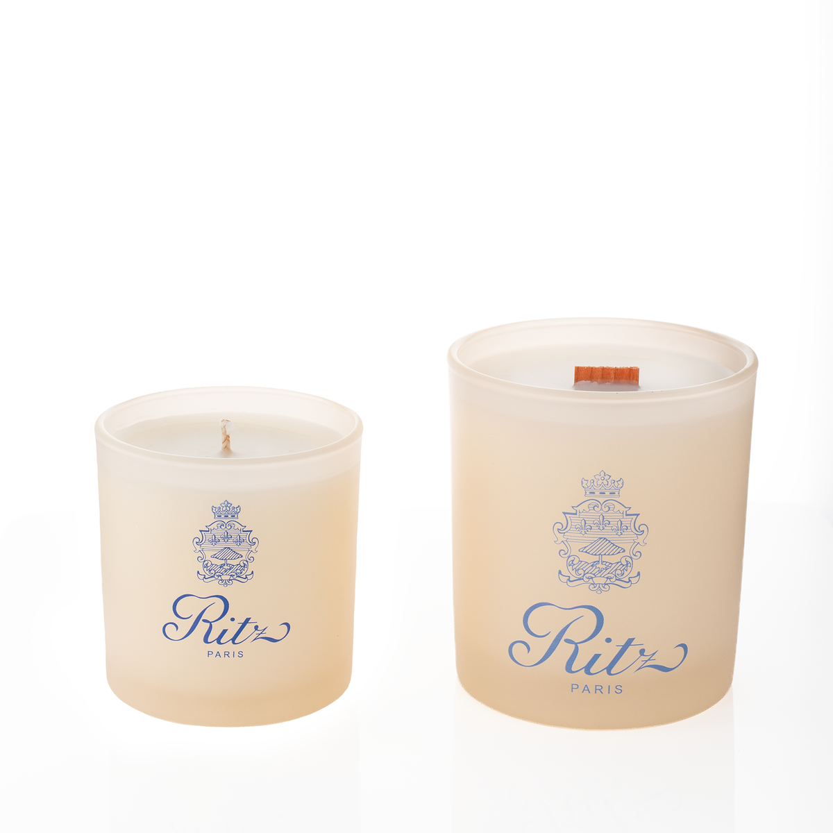 Ivory glass candles, 9 oz. beside 14 oz., both custom printed with the same logo, from Bath Promotions