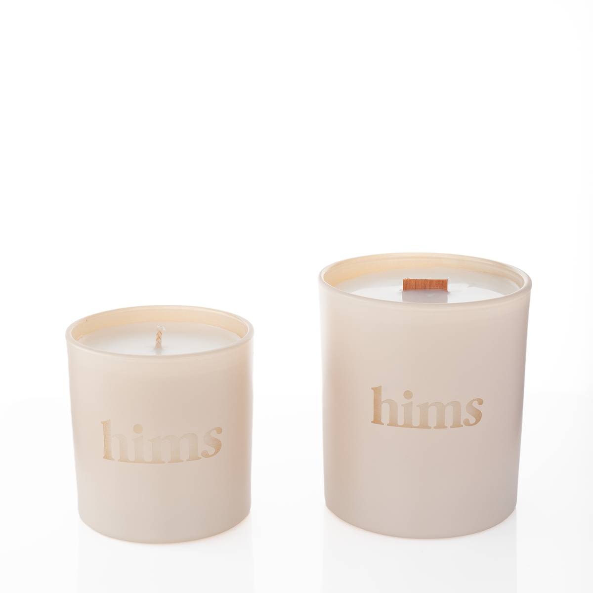Nude glass candles, 9 oz. beside 14 oz., both laser engraved with the same logo, from Bath Promotions