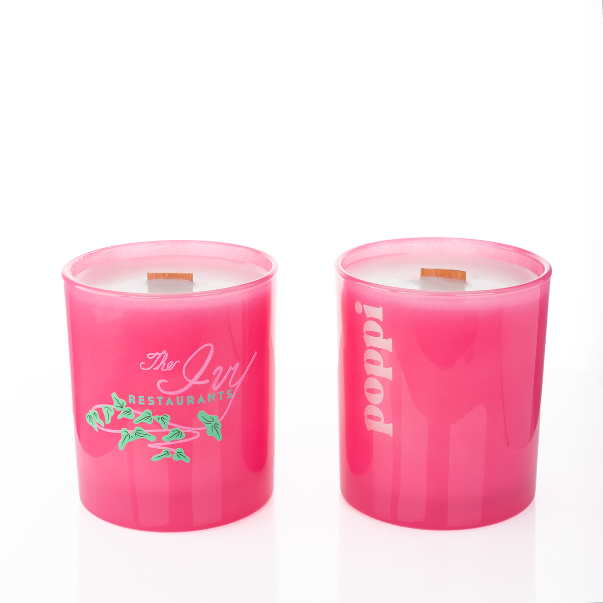 Pink glass, two 14 oz. candles side by side, one custom printed and one laser engraved, from Bath Promotions