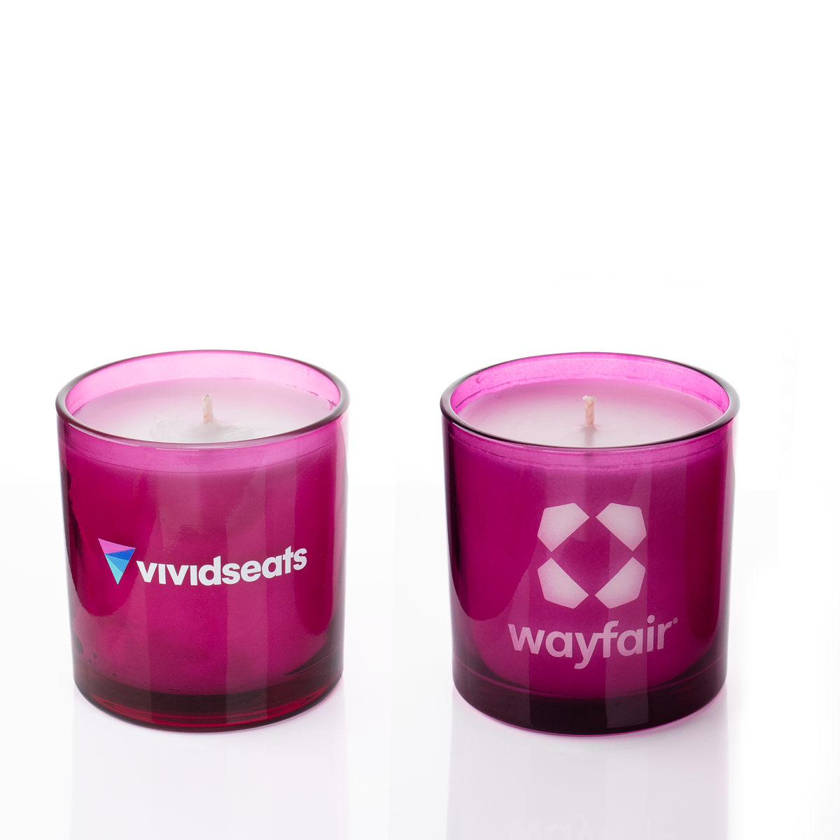 Purple glass, two 9 oz. candles side by side, one custom printed and one laser engraved, from Bath Promotions