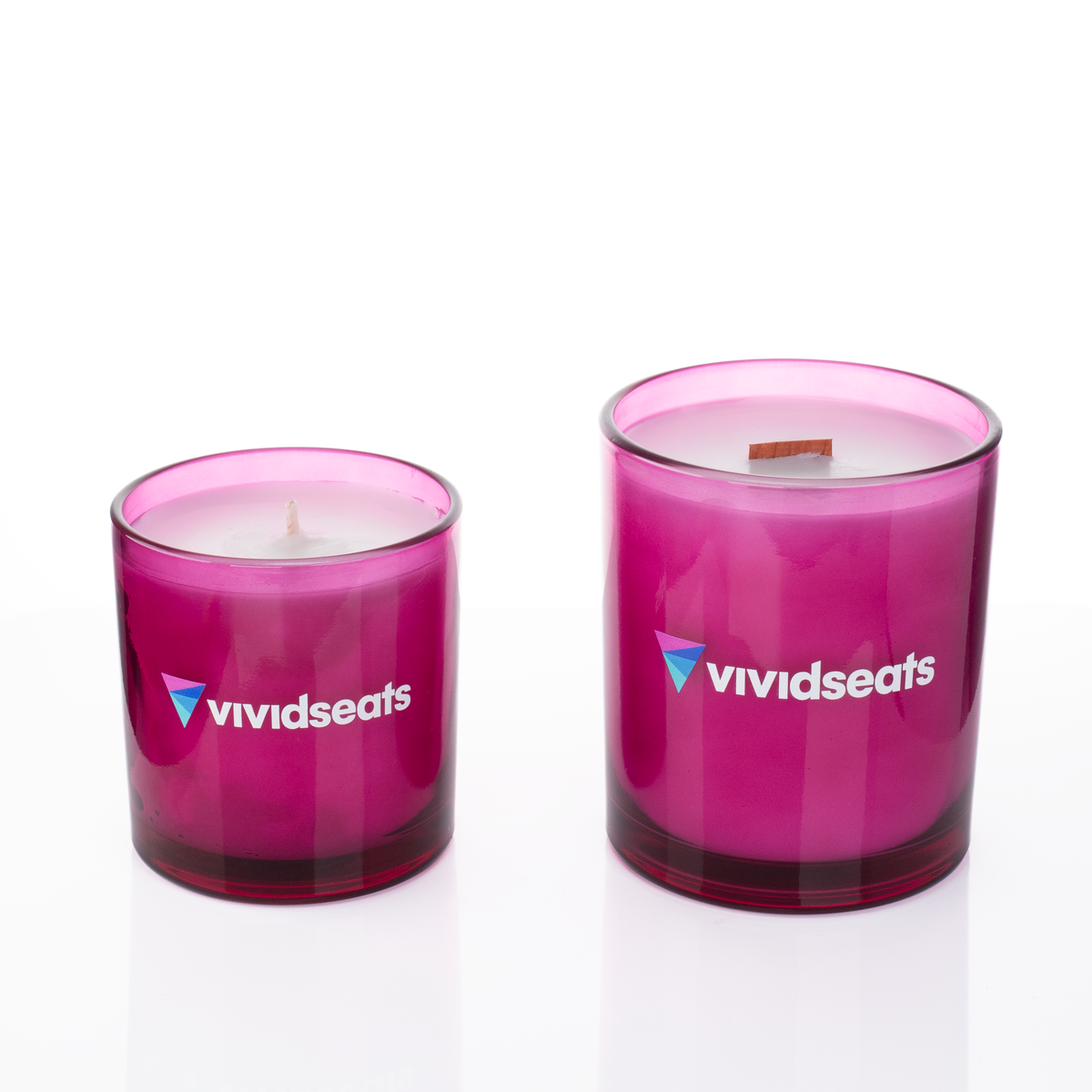 Purple glass candles, 9 oz. beside 14 oz., both custom printed with the same logo, from Bath Promotions