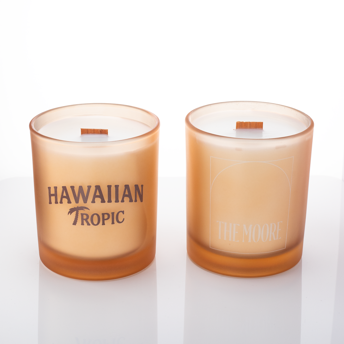 Sand glass, two 14 oz. candles side by side, one custom printed and one laser engraved, from Bath Promotions