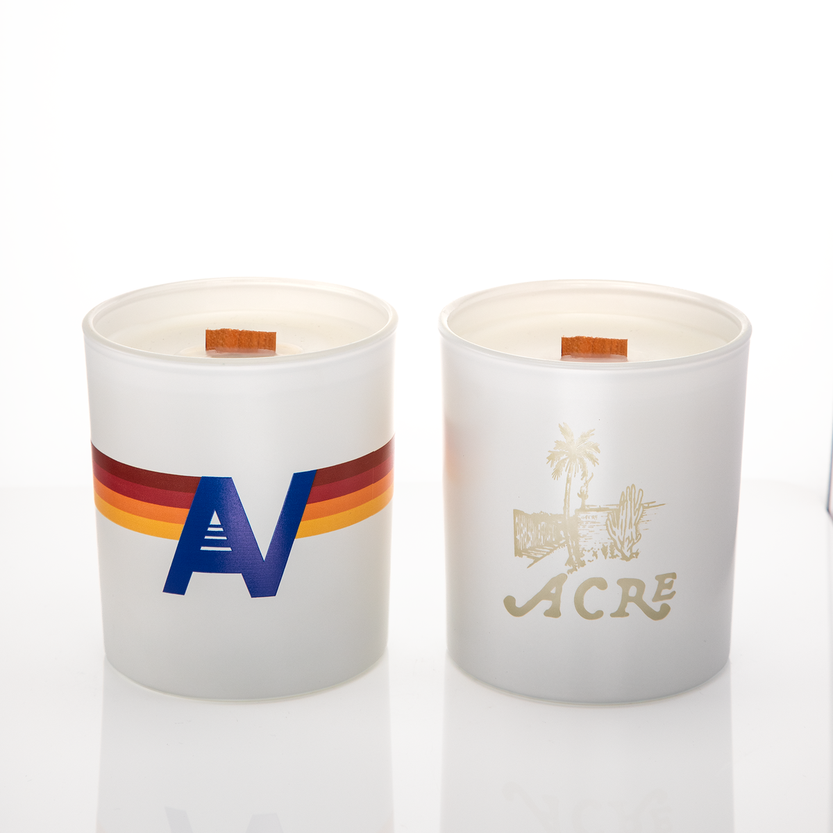 White glass, two 14 oz. candles side by side, one custom printed and one laser engraved, from Bath Promotions