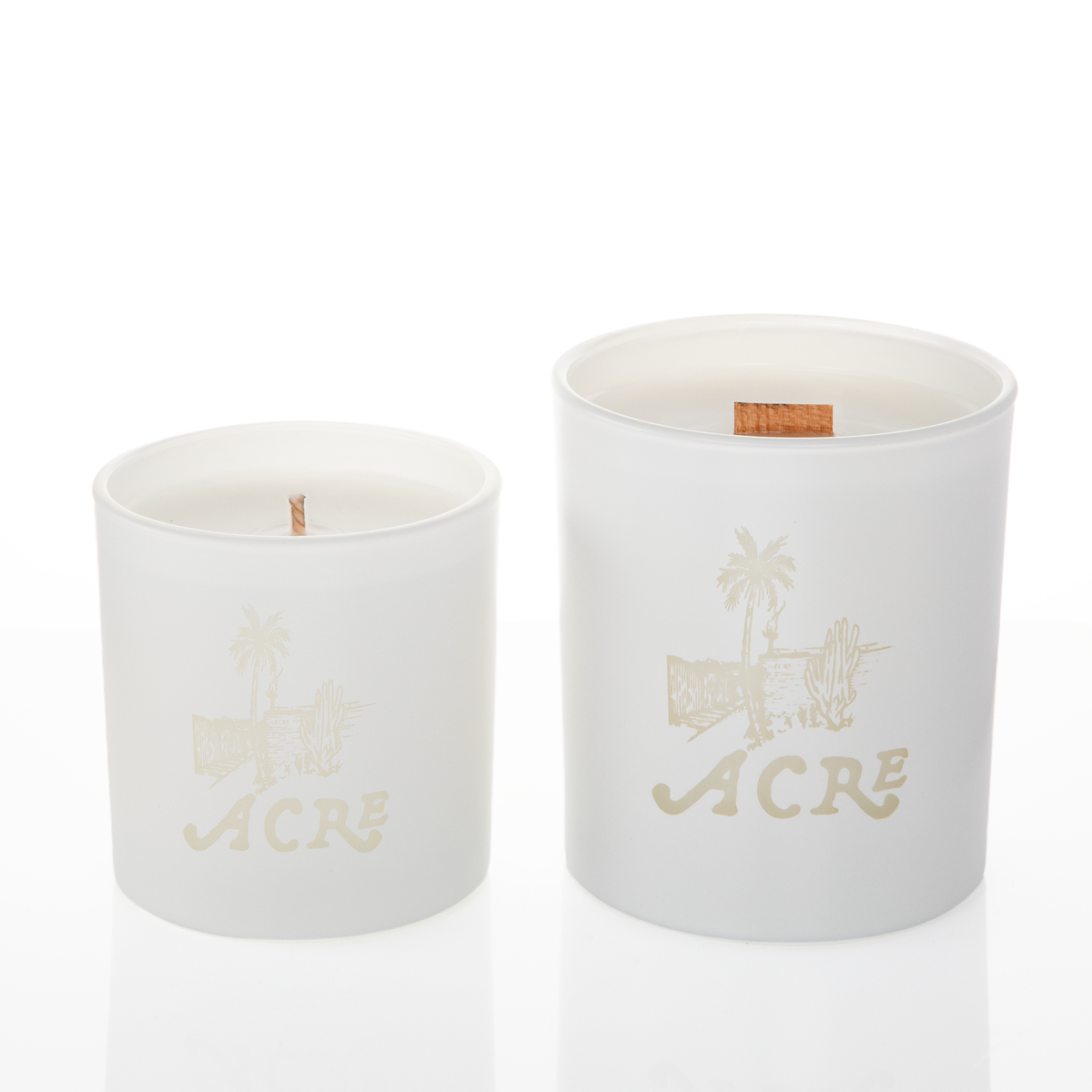 White glass candles, 9 oz. beside 14 oz., both laser engraved with the same logo, from Bath Promotions