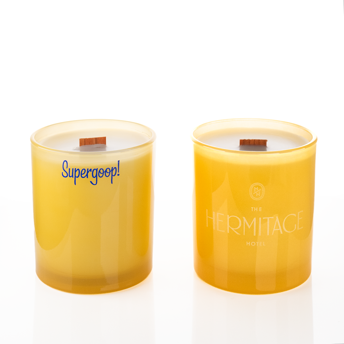 Yellow glass, two 14 oz. candles side by side, one custom printed and one laser engraved, from Bath Promotions
