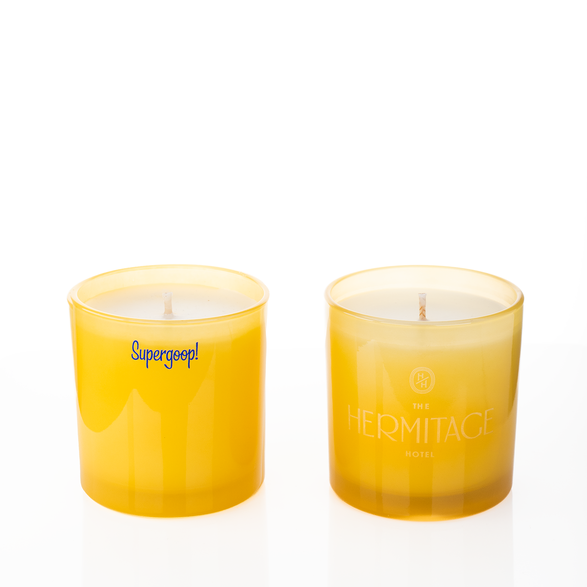 Yellow glass, two 9 oz. candles side by side, one custom printed and one laser engraved, from Bath Promotions