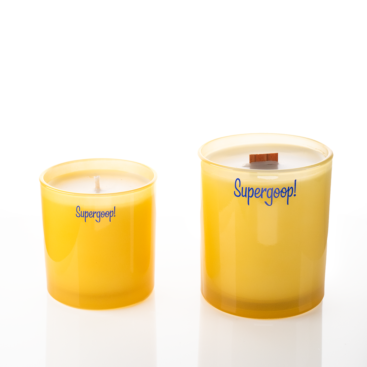 Yellow glass candles, 9 oz. beside 14 oz., both custom printed with the same logo, from Bath Promotions
