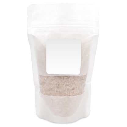 4 oz white resealable pouch containing bath salts with a white label. The transparent window shows the crystalline bath salt contents inside.