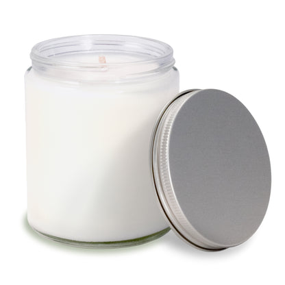 8 oz clear glass apothecary jar candle with silver screw-on lid off to the side.