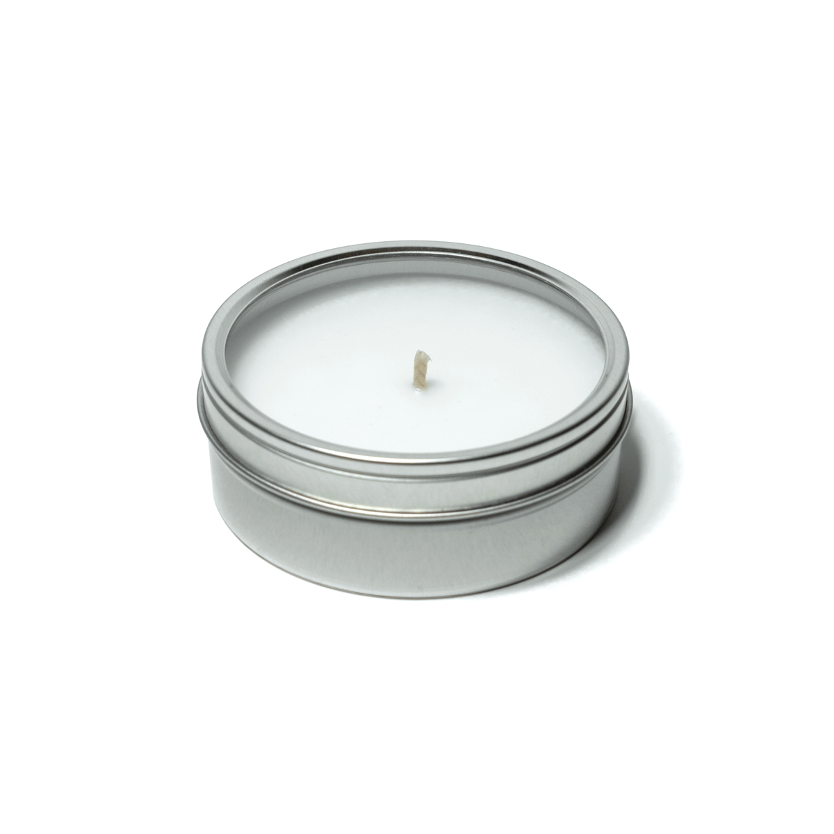 4 oz closed silver tin candle clear window displaying white wax and cotton wick.