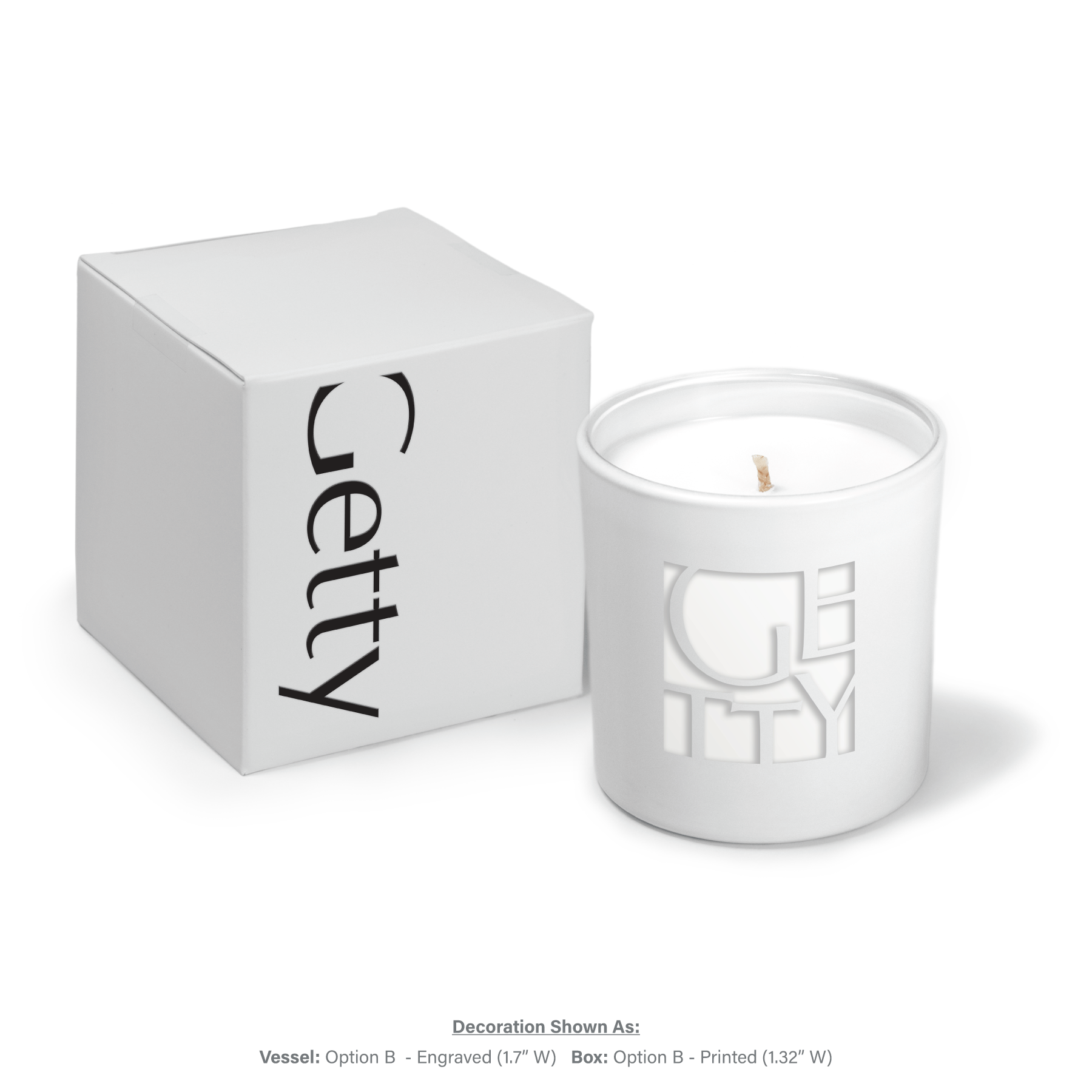 9 oz white glass candle with engraved logo and white wax next to white gift box with black text.