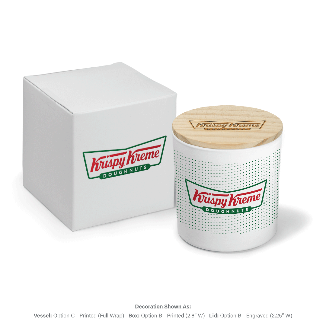 9 oz white glass candle with green and red logo covered with engraved wooden lid next to matching white gift box branding.