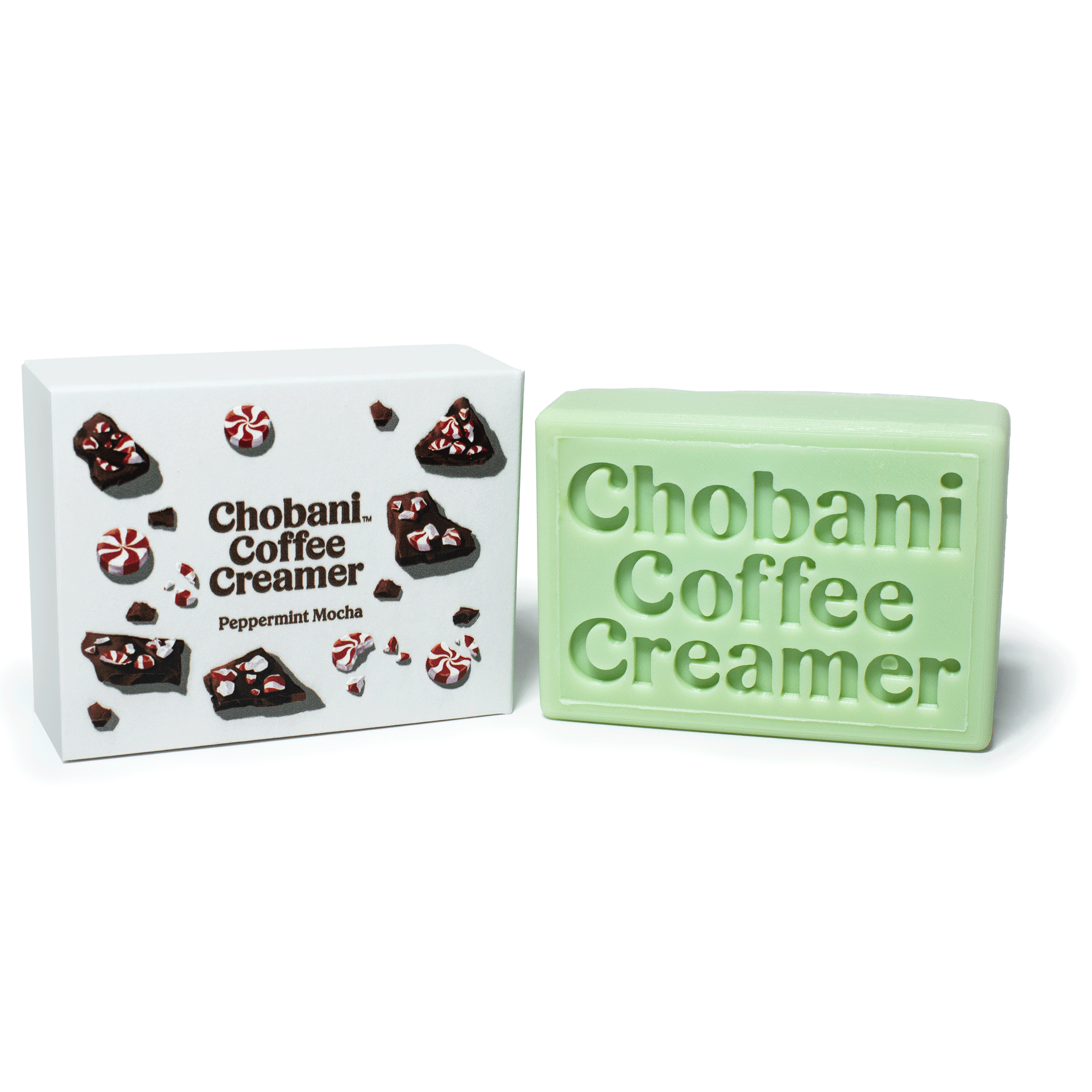 Light green rectangular bar soap with embossed logo next to branded white box.
