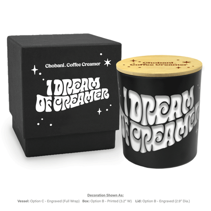 Close-up view of 14 oz black luxury candle showing engraved personalization detail and an accompanying engraved lid