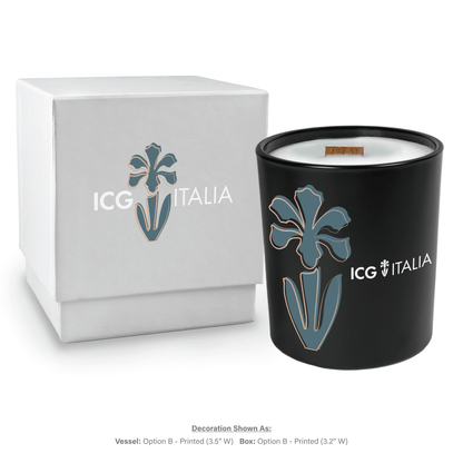 14 oz black glass candle with wooden wick and white wax next to matching white gift box, both featuring multicolor branding.